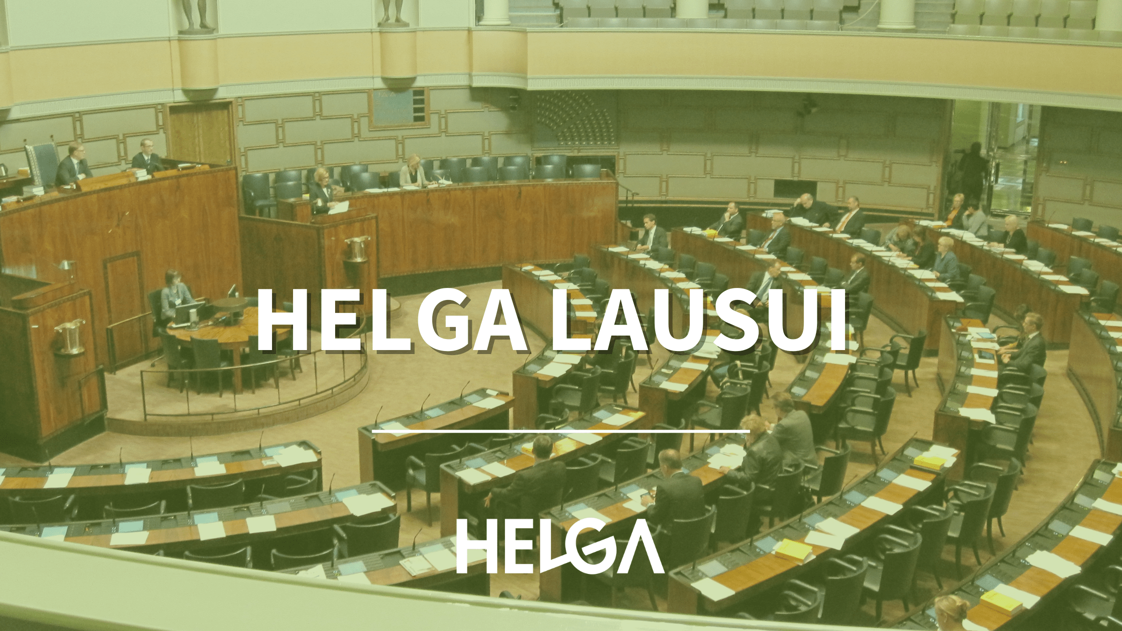 Kuva: Eduskunnan istuntosali Teksti: Helga lausui